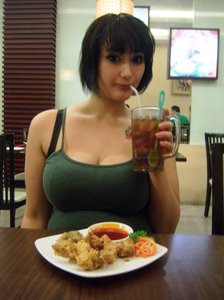 cute girl eating the a restaurant